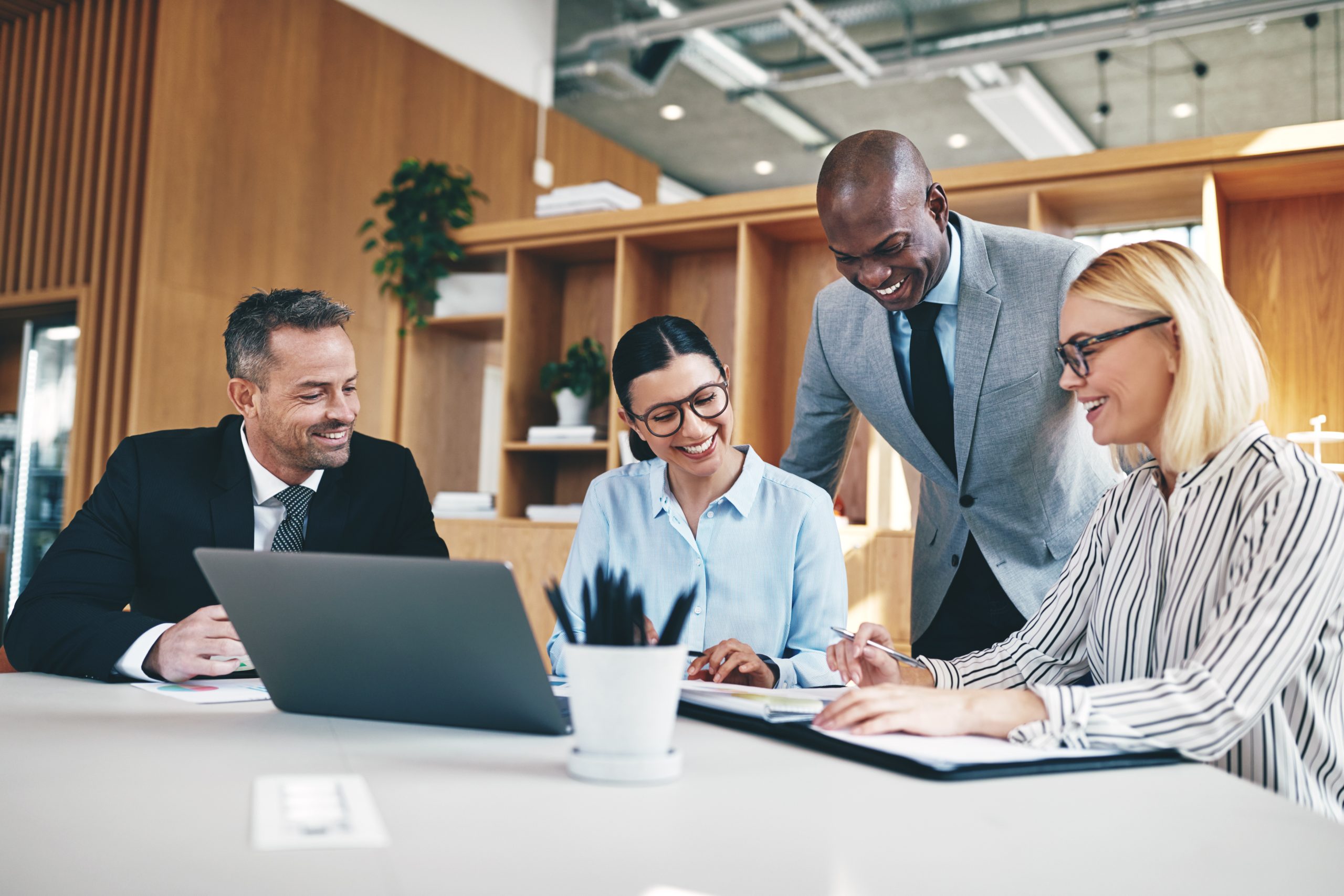 Diverse group of businesspeople laughing together during an offsite